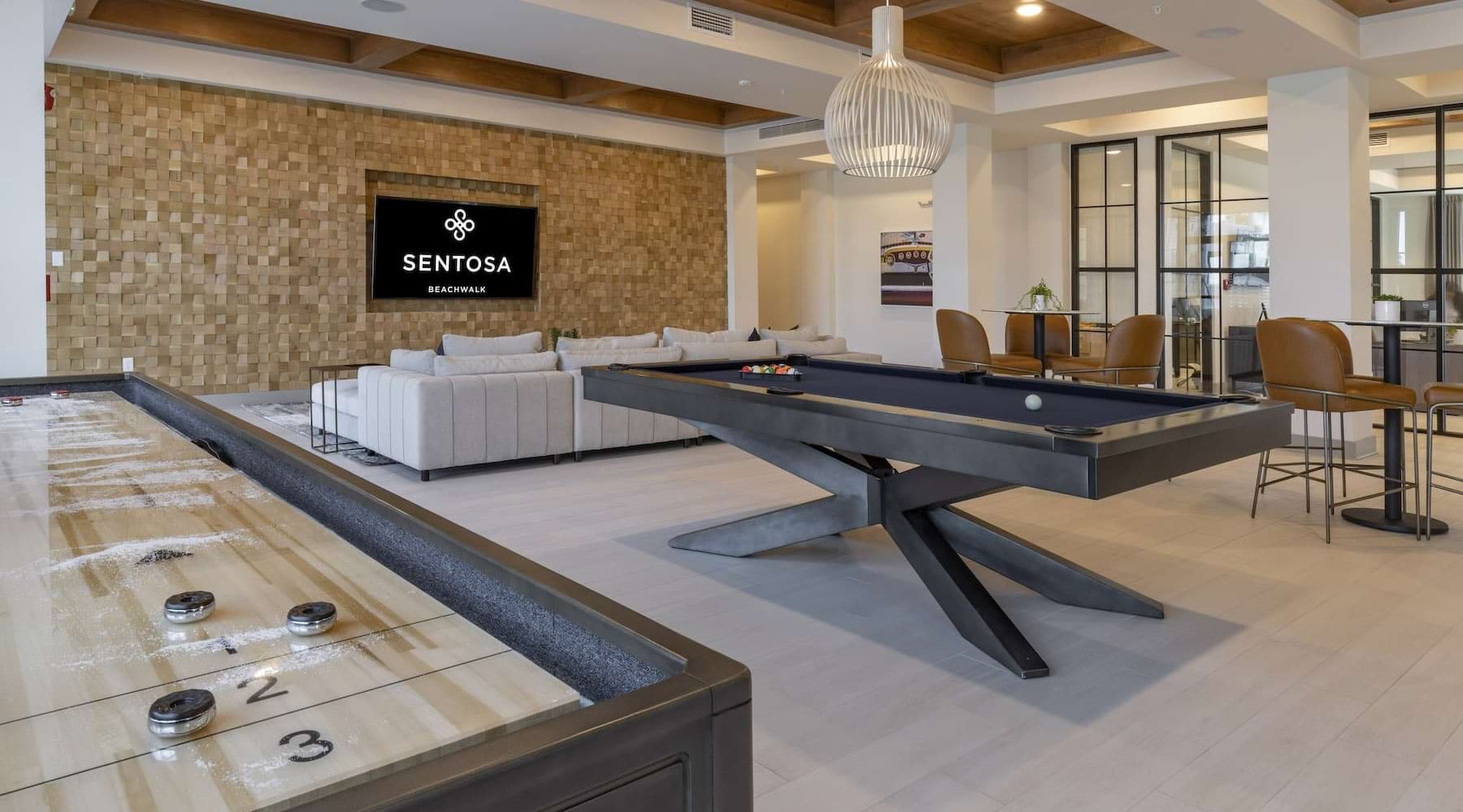 LIFE WELL LIVED game room on wood-style flooring